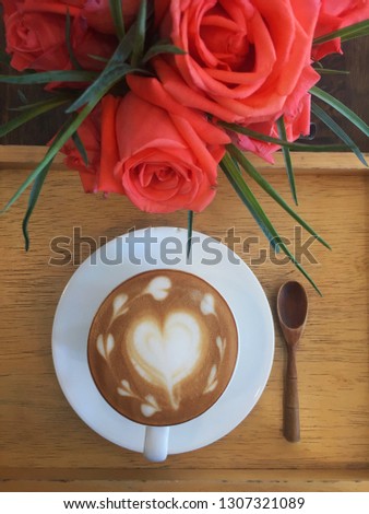 Hot coffee in cup on wood table soft focus