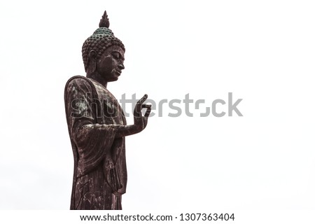 White standing Buddha statue