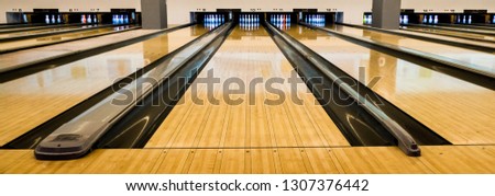 Bowling balls and wooden lane. 