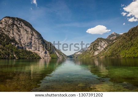 Beautiful panorama on Kenigssee lake.Colorful morning view of the Bavarian Alps on the border of Austria, Germany, Europe.Photo of beautiful landscape.Green water with montains.