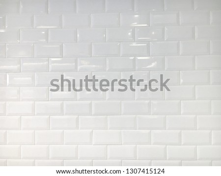 White ceramic tiles wall for background.