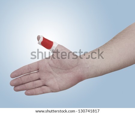 A person medically dressed with a cotton ball and bandage over a wound. Pain concept photo with Color Enhanced