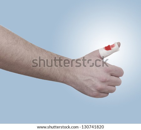 A person medically dressed with a cotton ball and bandage over a wound. Pain concept photo with Color Enhanced