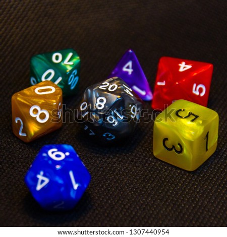 Colorful dice set on black background