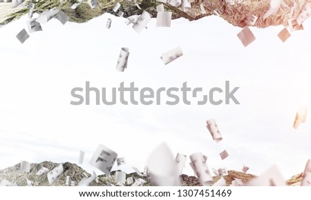 Abstract image of two nature worlds located among flying papers and upside down to each other on sky background. Wallpaper, backdrop with copyspace.