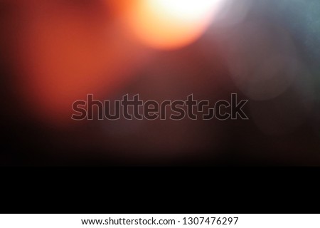 Blank grained and scratched film strip texture background with heavy grain, dust and a light leak Real Lens Flare Shot in Studio over Black Background. Easy to add as Overlay or Screen Filter  Royalty-Free Stock Photo #1307476297