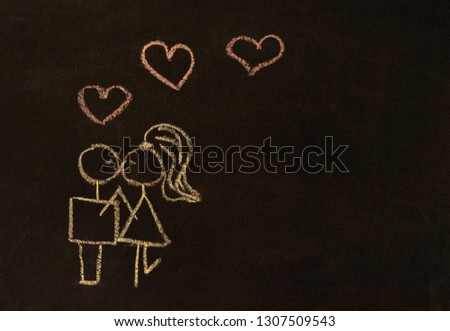 Chalk drawing on the board. Couple in love kissing. Valentine's day greeting card or just a romantic relationship card, banner, design for lovers.