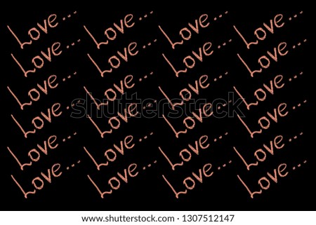Written in red chalk many times the word love on a black board. Background or texture for your design.