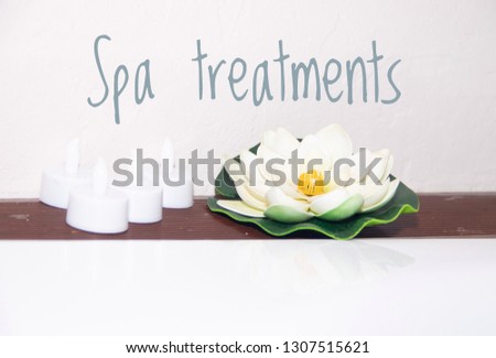 Picture with text SPA treatments. Banner advertising spa salon. Spa treatments. The rest of the soul and body.