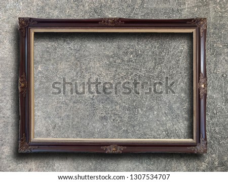 Close up old rustic picture frame on cement wall texture background