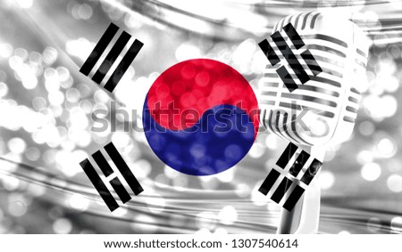 Microphone on a background of a blurry South Korea flag close-up