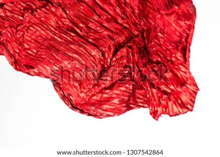 Close-up of red paper with silver. Red, silver, metallic texture.