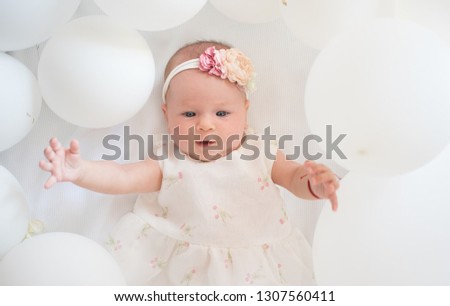 My sweet baby. Family. Child care. Childrens day. Small girl. Happy birthday. Childhood happiness. Portrait of happy little child in white balloons. Sweet little baby. New life and birth.