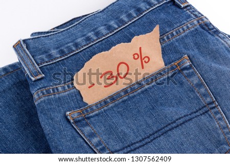 Thirty percent off label in jeans pocket