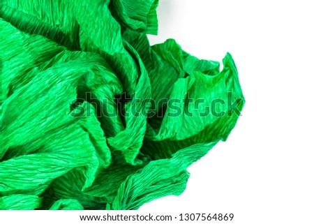 Crumpled paper on white background. Green, turquoise.Texture.