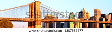 New York, USA. View of Manhattan bridge and Manhattan in New York, USA in the morning. Clear blue sky with skyscrapers