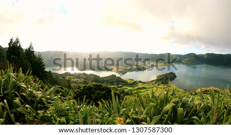 A panoramic lake view Royalty-Free Stock Photo #1307587300