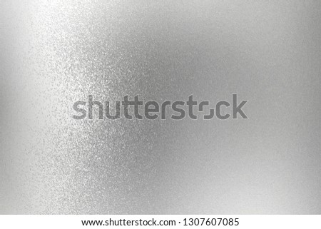 Texture of silver rough metallic panel, abstract background
