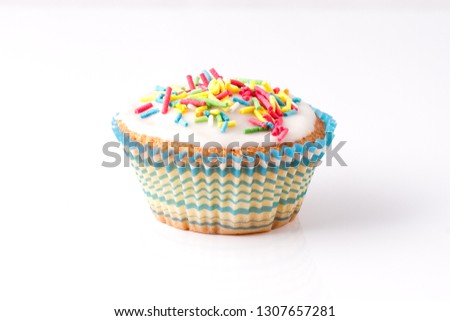 Colourful cupcakes on a white background.