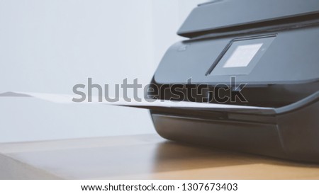 A close up of a printer on a table.