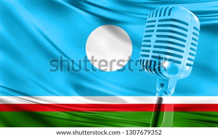 Microphone on fabric background of flag of Sakha Republic close-up