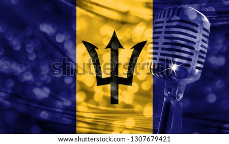Microphone on a background of a blurry Barbados flag close-up