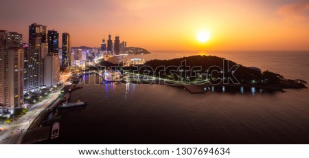 Busan beach view in Busan city day to night picture with sunrise sky and full moon, South Korea, this picture can use for tavel, Busa, South Korea and  city concept