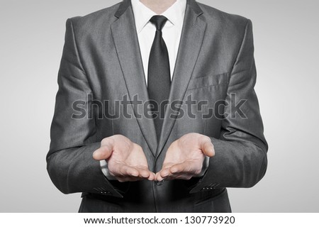 Businessman empty open cupped hands, over white background
