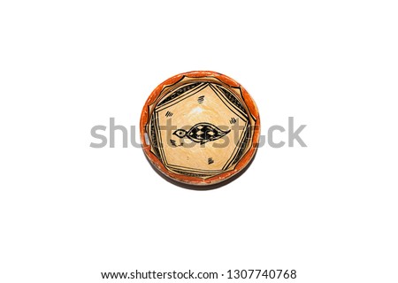 terracotta or pottery dish with turtle decoration isolated on white background
