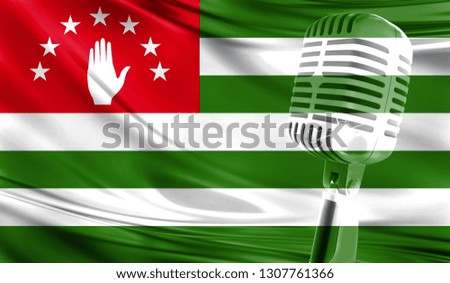 Microphone on fabric background of flag of Abkhazia close-up