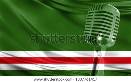 Microphone on fabric background of flag of Chechen Republic of Ichkeria close-up