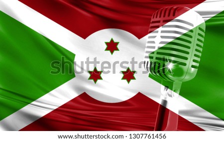 Microphone on fabric background of flag of Burundi close-up