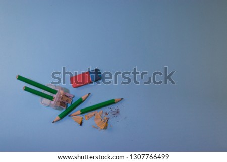 Pencils and Eraser on a blue background. Stationery