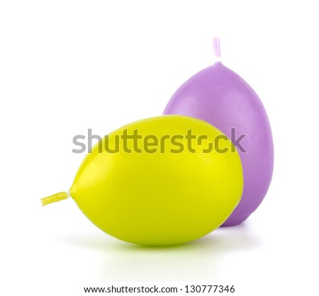 Colorful Easter candles  isolated on white background