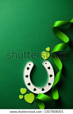 St Patrick's Day green background with lucky horseshoe