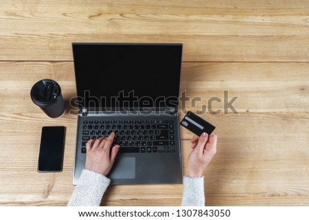 High angle above top view and cropped photo of person lady in casual wear sitting inside loft interior space coworking. She using portable laptop to buy stuff online