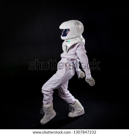 Running Astronaut in space, in zero gravity on black background.