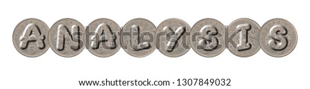 ANALYSIS written with old British coins on white background