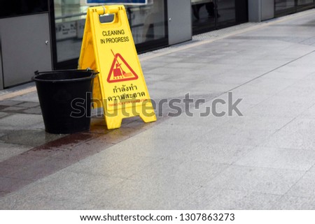 the safety first yellow floor cautioned the signage has a wet floor and cleaning, Cleaning in progress, Thanks for your cooperation