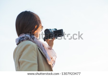woman vlogger recording videos outdoors