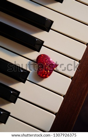 red heart on piano keys