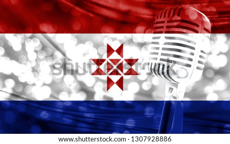 Microphone on a background of a blurry Mordovia flag close-up