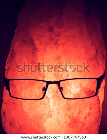 Red rock man with glasses