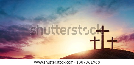 Silhouette cross on Calvary mountain sunset background. Easter concept