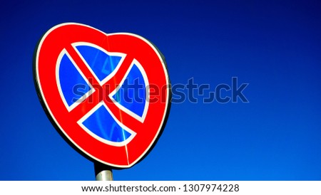 road sign banned parking in the shape of a heart seen from below. conceptual photo for valentine's day