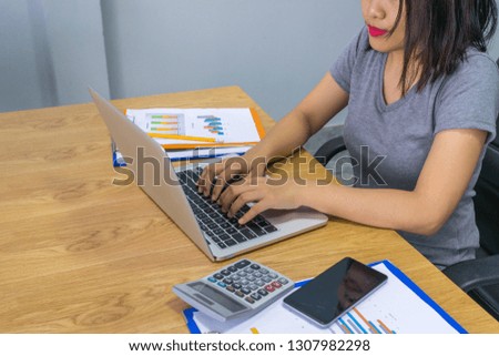 Businesswoman working on laptop in the meeting room