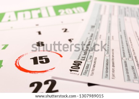 2019 calendar with 1040 income tax form for 2018 showing tax day for filing on April 15