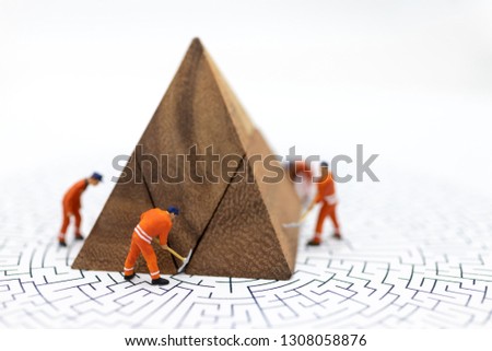 Miniature people : Workers are repairing, fixing business profits, graph,  Use image for illustrations, problem solving, business solutions concept.