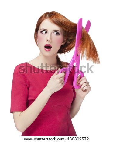 Redhead girl with big scissors