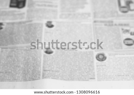 Newspaper Page With Headlines and Articles, Old Unreadable News. Blurred Background Texture 